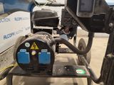 a machine that is sitting on a cart in a garage