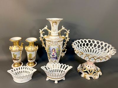 many different types of vases and bowls on the table