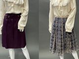two mannequins dressed in different styles of clothing on a mannequin stand