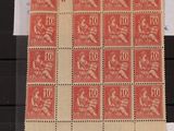 a close up of a sheet of stamps with a picture of a woman on it