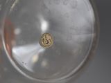 a close up view of a glass with a coin in it