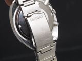 a close up of a person holding a wrist watch