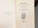 an open book with a picture of a man on it