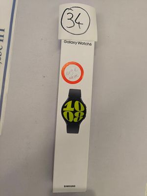 a box with a watch on it sitting on a table