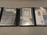 several different types of stamps and envelopes are lined up on a table
