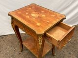 a small wooden table with a drawer on top of it