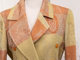 an orange and gold jacket on a mannequin mannequin mannequin mannequin mannequin mannequin mannequin mannequin mann
