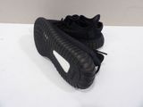 adidas yeeze black and white sneakers on a white surface