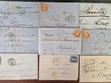 several old envelopes are sitting on top of a wooden table