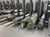 many different types of steel bars in a warehouse