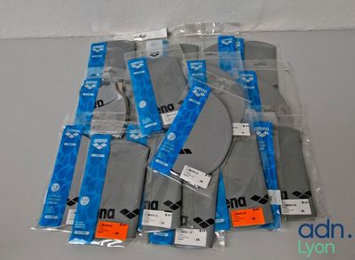 a lot of bags of gray and blue items on a table