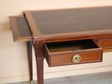 an image of a desk with a drawer underneath it