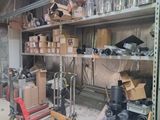 many boxes and boxes on the shelves in the garage