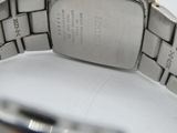 a close up of a wrist watch on a white surface