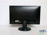 a computer monitor sitting on top of a white table