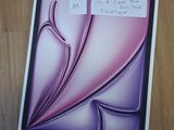 a picture of a picture of a purple flower on a table