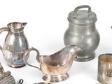 a lot of silver items that are on the table