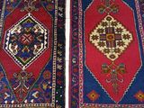 pair of oriental rugs on a white floor in a room