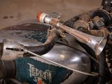 a close up of a motorcycle that is parked in a garage