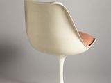 an image of a white chair with a wooden seat on a grey surface