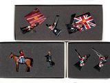 several figurines of people riding horses and holding flags in a box
