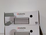 two boxes of baabania are stacked on top of each other on a white surface