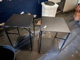 two tables in a room with a trash can in the background