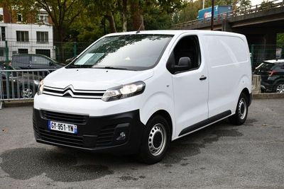 a white van that is parked in a parking lot