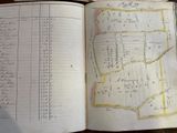 an open book that has a map of a town in it