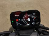 a close up of a motorcycle with a speedometer on it