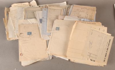 a lot of old letters and envelopes sitting on a table