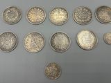 a collection of british coins including one penny, one penny, one penny and one penny