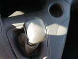 a close up of a car dashboard with a gear stick
