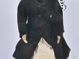 a small doll that is sitting on a clear box