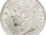 an image of a silver coin with a portrait of queen elizabeth