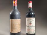 two bottles of wine sitting next to each other on a table