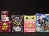 five boxes of cereal sitting on a black surface