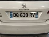 a white car that is parked in a garage