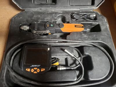 a black case with a digital device inside of it