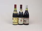 three bottles of wine sitting next to each other on a white surface