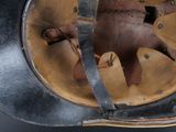 a close up of a helmet on a table