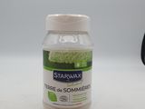 une bouteille de cire « Star Wax » posée sur une table