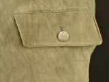 a close up of a button on the pocket of a jacket