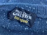 a close up of a label on a blue sweater
