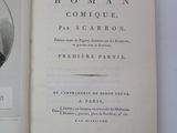 an open book with a picture of a man in a suit and tie
