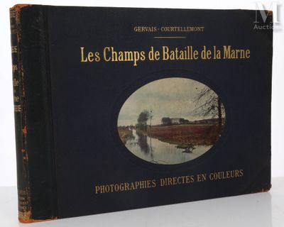 books on a table with a picture of a river in the background