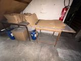 a table with boxes on it in a garage