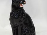 an image of a black cat figurine on a white background