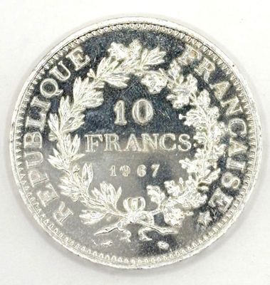 a close up of a coin on a white surface