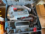 a tool box with tools in it sitting on a table